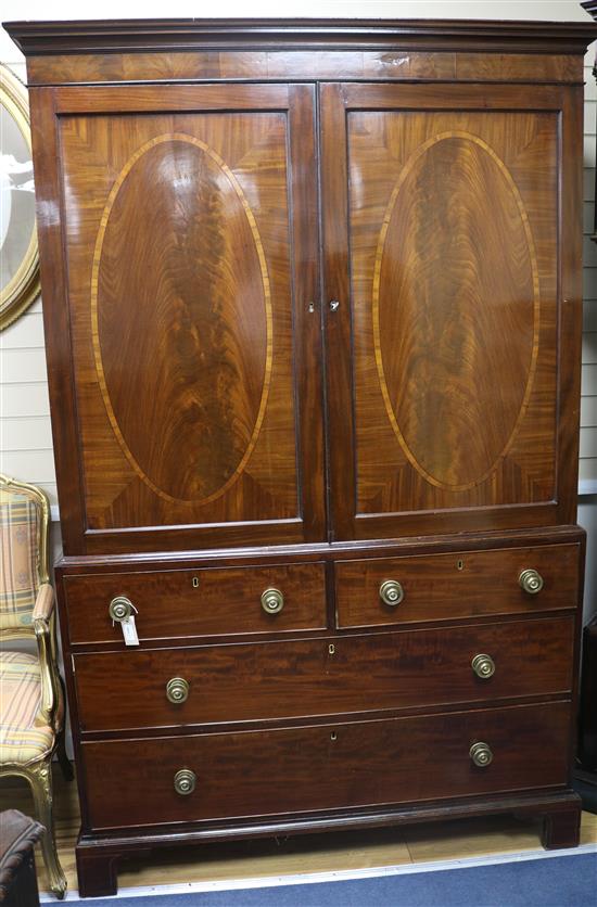 A George III mahogany linen press fitted sliding trays, 225cm high